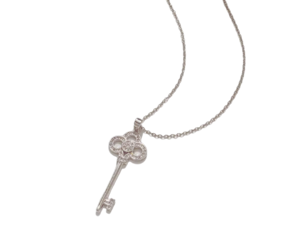 Elegant skeleton key pendant with cubic zirconia accents, symbolizing self-expression and the power to unlock lifeās beauty.