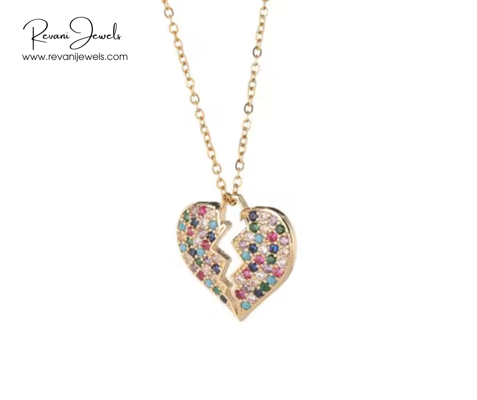Heart-shaped jewelry with colorful stones on a gold chain, branded 'Revani Jewels'.