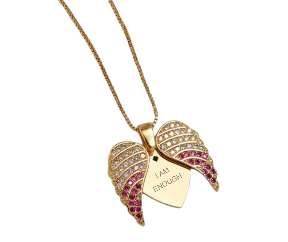 Gold angel wing pendant with CZ accents concealing an engraved "I Am Enough" heart, symbolizing protection, self-love, and empowerment.