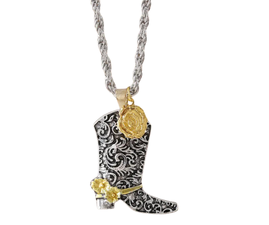 Silver-and-black cowboy boot pendant with gold wildflowers on an 18-inch chain, blending vintage charm with free-spirited style.