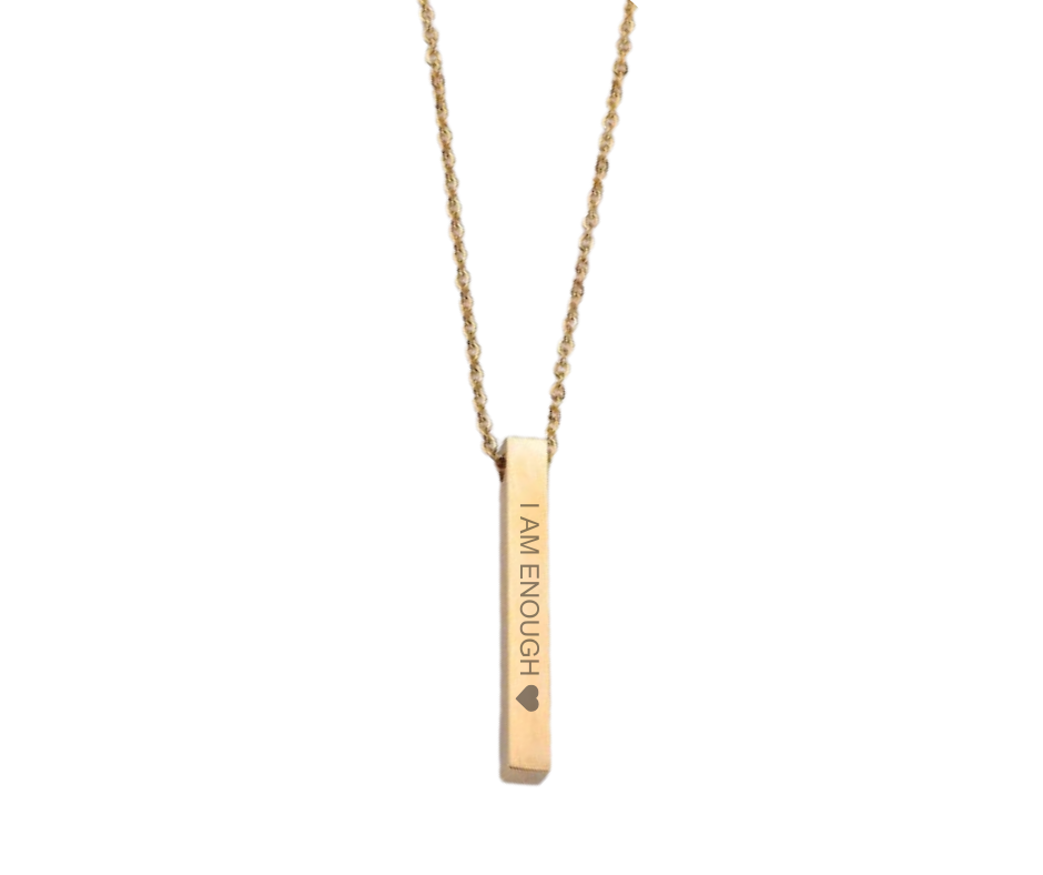 Sleek bar pendant necklace engraved with affirmations and a heart, symbolizing strength, value, and self-love. 5 colors available: Gold, Silver, Rose Gold, Iridescent, Black. 