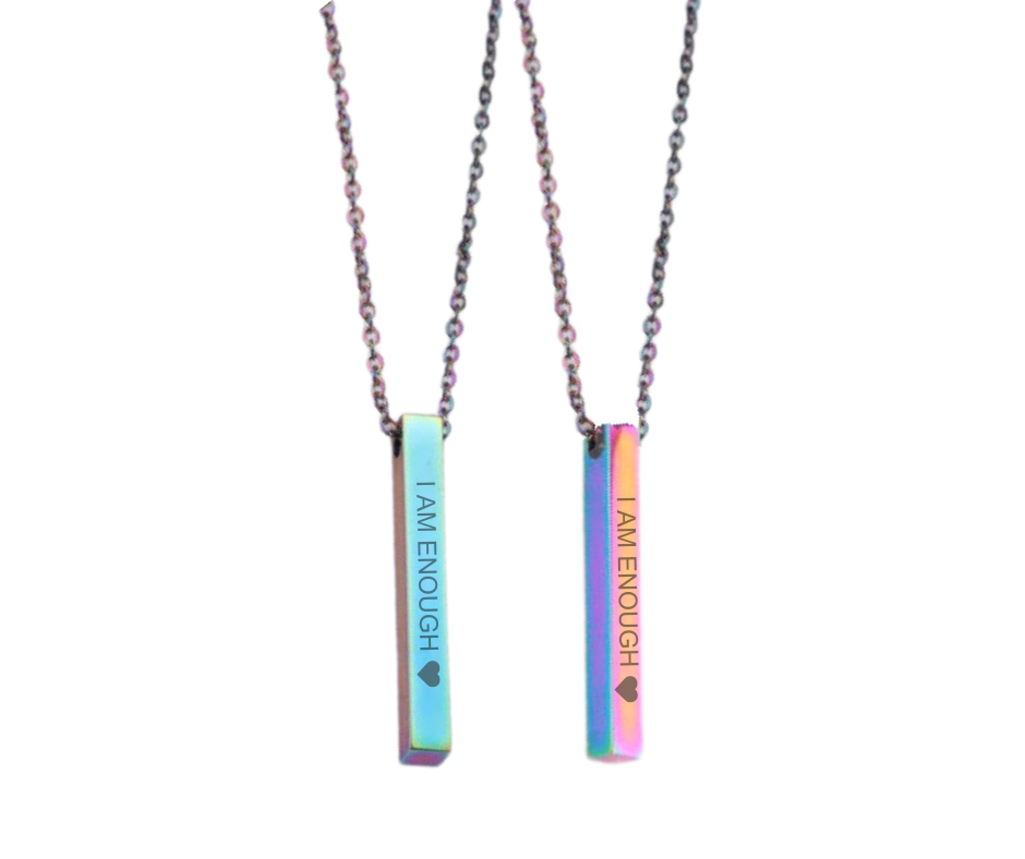 Sleek bar pendant necklace engraved with affirmations and a heart, symbolizing strength, value, and self-love. 5 colors available: Gold, Silver, Rose Gold, Iridescent, Black.