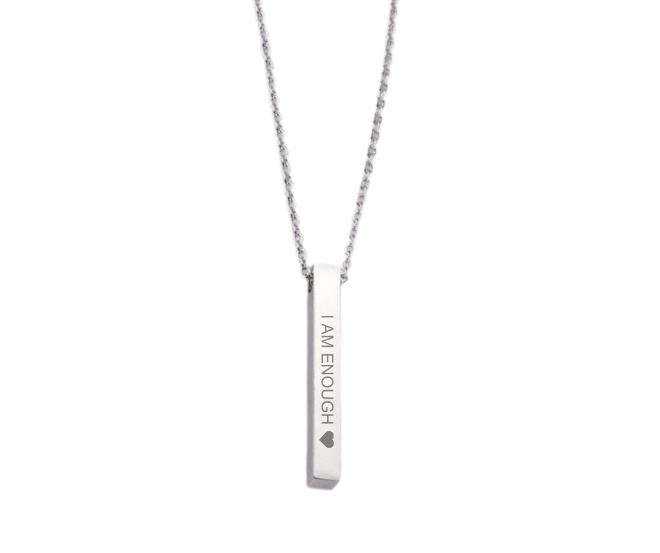 Sleek bar pendant necklace engraved with affirmations and a heart, symbolizing strength, value, and self-love. 5 colors available: Gold, Silver, Rose Gold, Iridescent, Black.