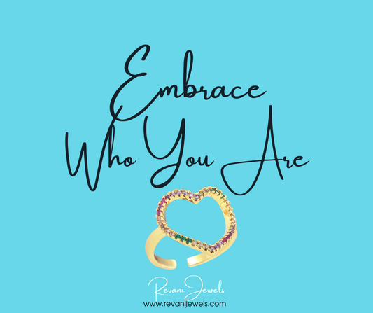 Gold-plated adjustable heart ring with rainbow cubic zirconia, celebrating individuality, positivity, and self-expression with vibrant charm.