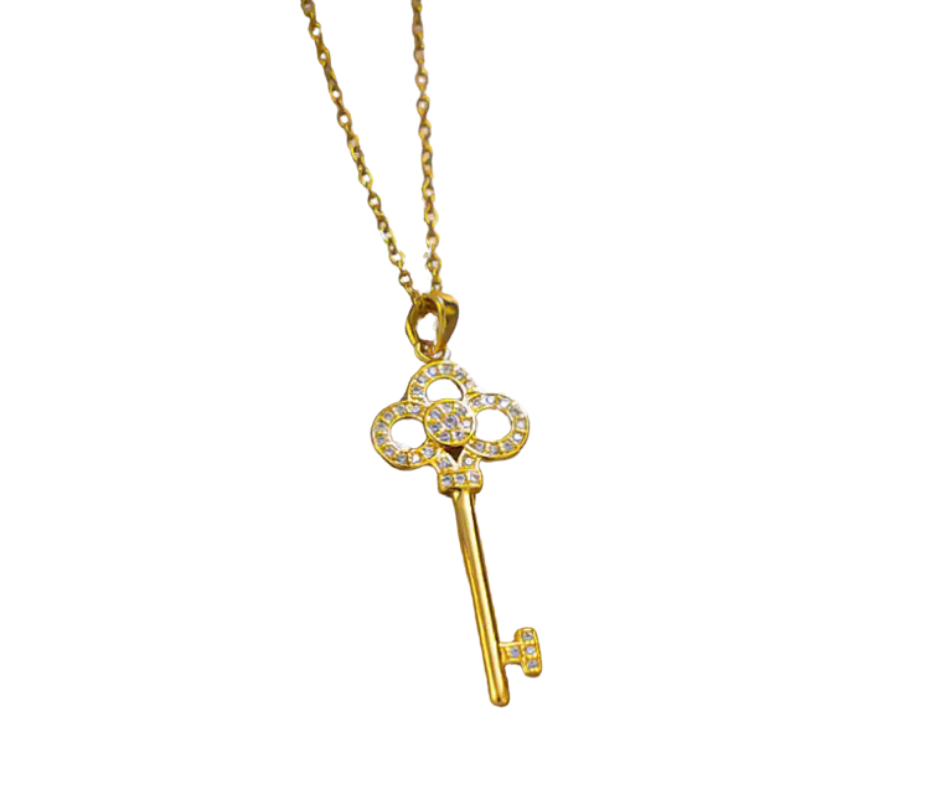 Elegant skeleton key pendant with cubic zirconia accents, symbolizing self-expression and the power to unlock life’s beauty.