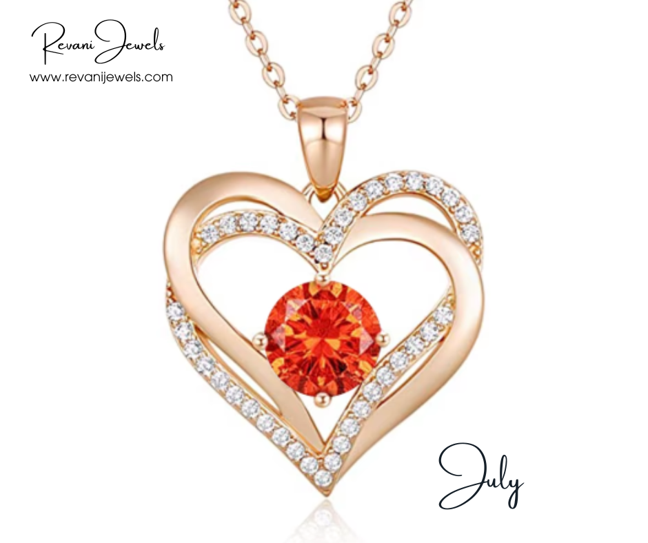 Heart-shaped gold pendant with a red gemstone and diamonds, branded 'Revani Jewels'.