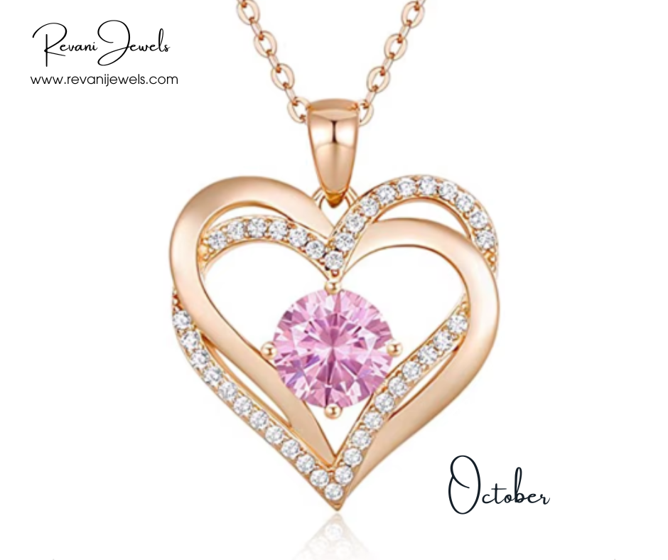 Heart-shaped gold pendant with pink gemstone and diamonds, branded 'Revani Jewels'.