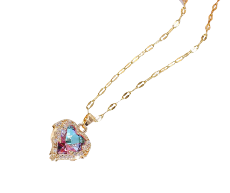 Heart-shaped pink-to-purple gradient gemstone pendant with angelic wings, cubic zirconia accents, and gold-tone elegance.