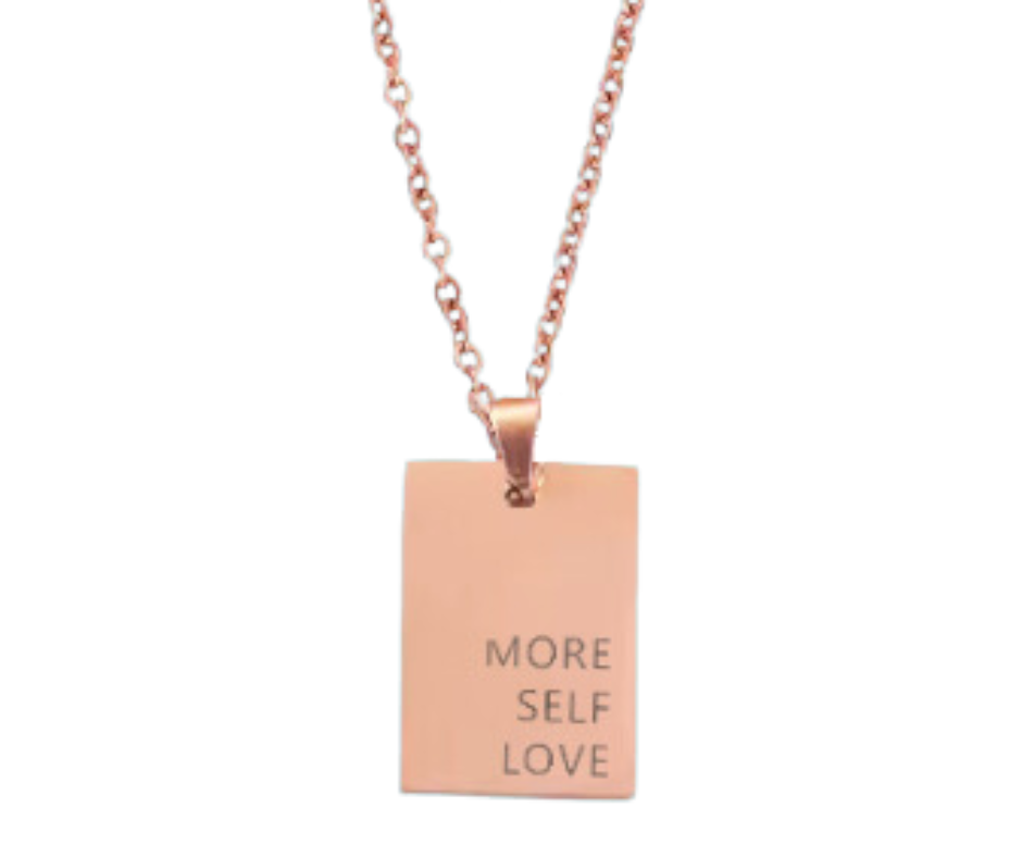 Gold, silver, or rose gold rectangular pendant engraved with "More Self Love," on an 18-inch chain. A daily reminder of self-compassion.