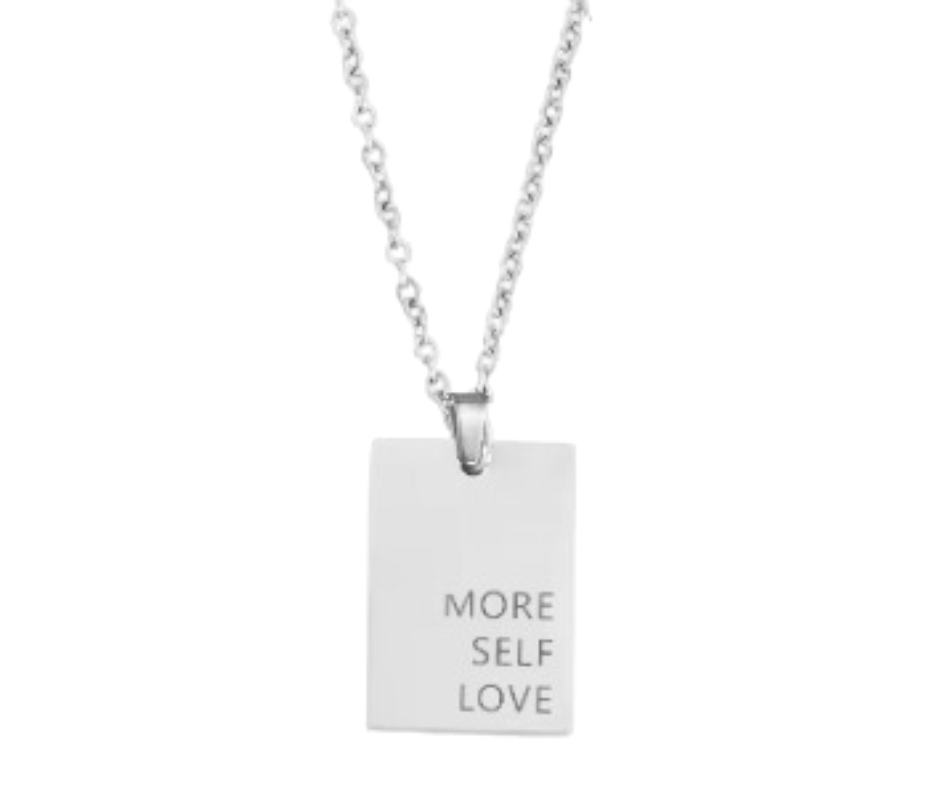 Gold, silver, or rose gold rectangular pendant engraved with "More Self Love," on an 18-inch chain. A daily reminder of self-compassion.
