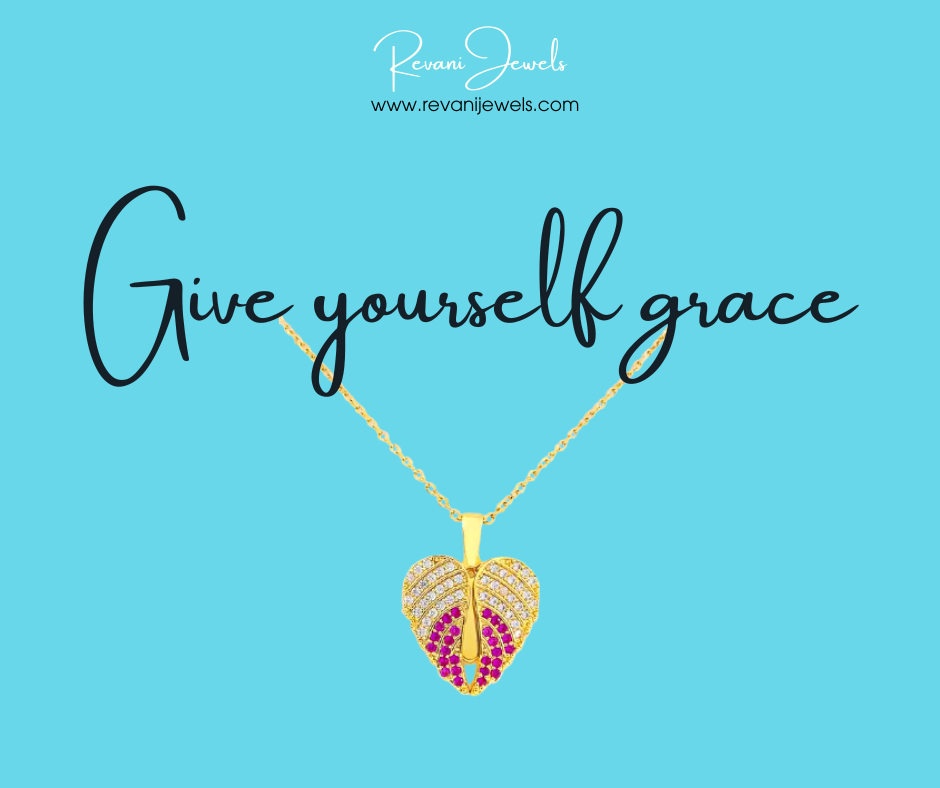 Gold necklace with a heart-shaped pendant on a blue background with 'Give yourself grace' text and Revani Jewels branding.