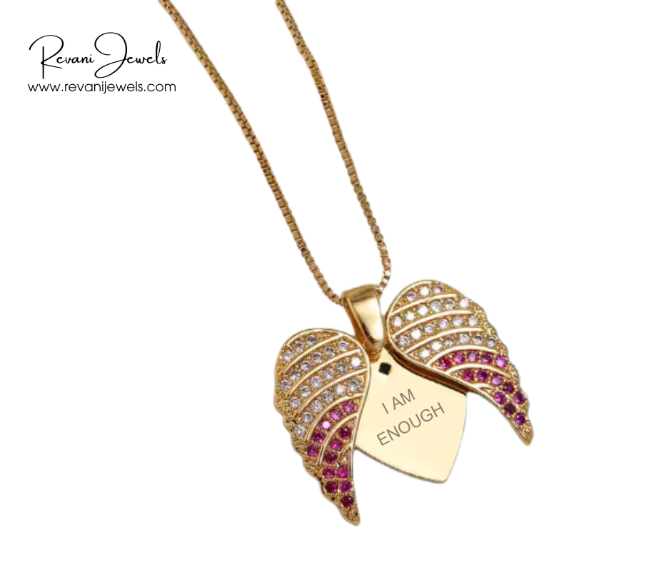 Gold necklace with leaf-shaped pendant and 'I AM ENOUGH' tag, branded as Revani Jewels.