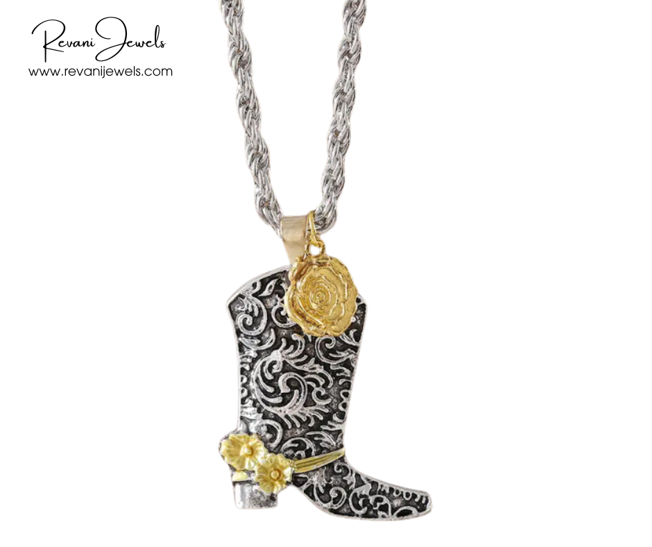 Cowboy boot pendant with gold accents on a chain, branded 'Revanj Jewels'.