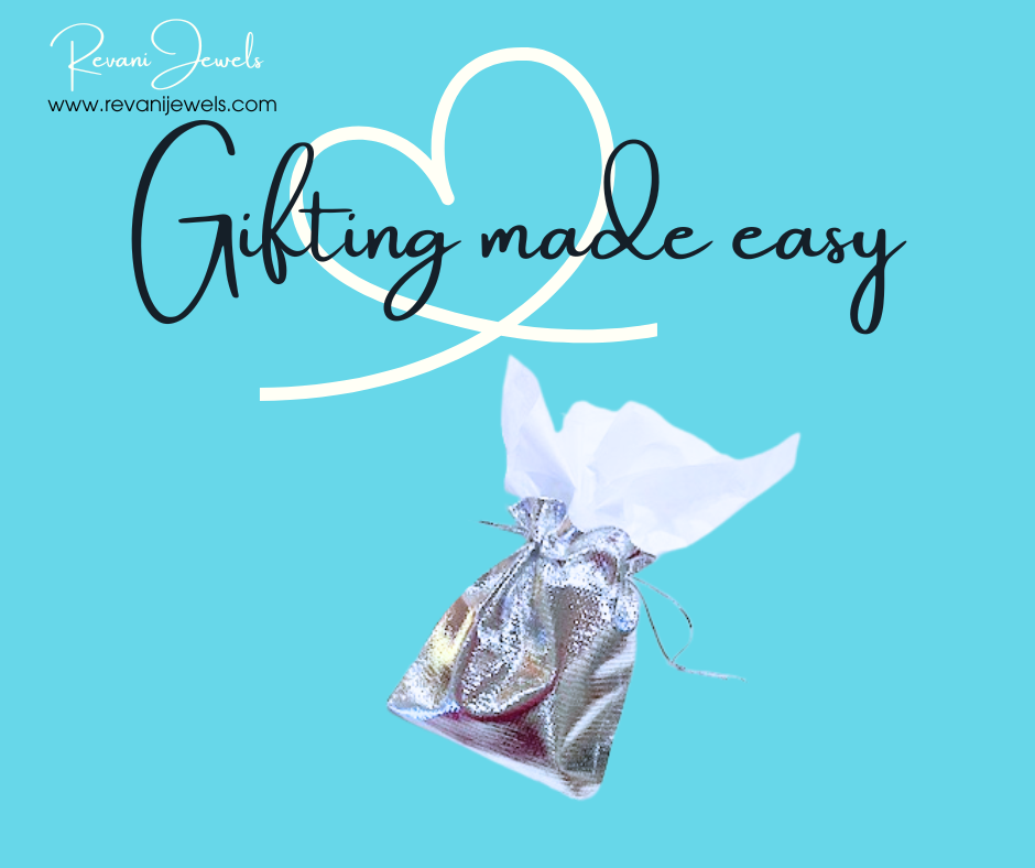 Silver gift bag with white tissue paper on a blue background with 'Gifting made easy' text and Revan Jewels logo.