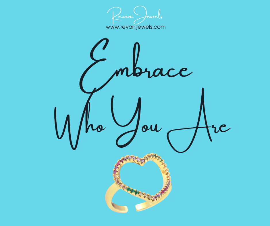 Gold ring with colorful stones on a blue background with 'Embrace Who You Are' text and Revani Jewels branding.