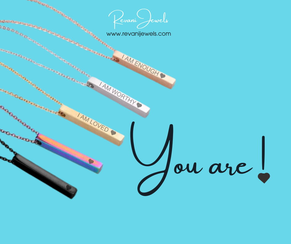 Necklace with motivational pendants on a blue background, featuring Revani Jewels branding.