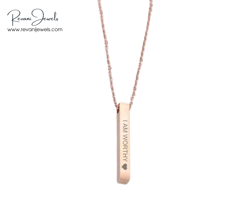 Rose gold necklace with 'I AM WORTHY' pendant on a white background, branded 'Revani Jewels'.