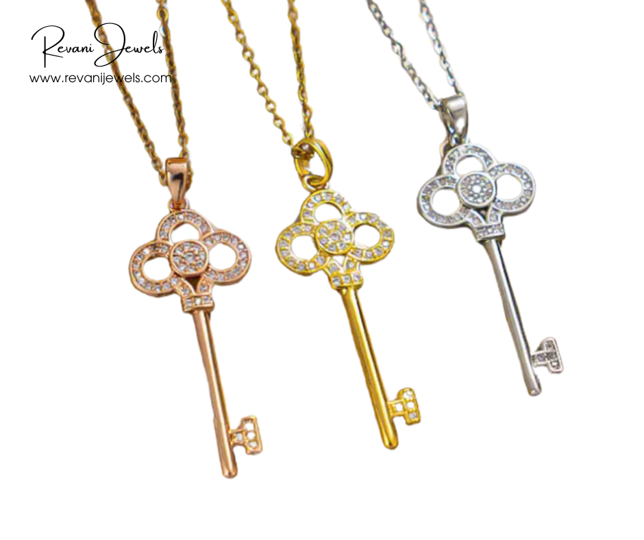 Three key-shaped pendants on chains with 'Revani Jewels' branding.