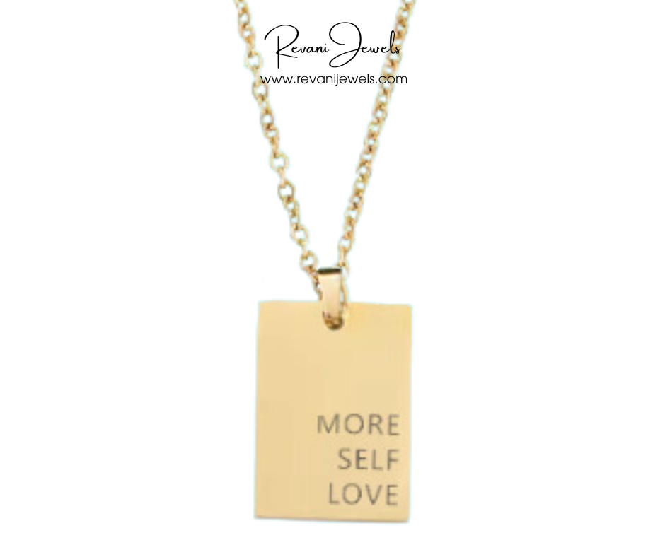 Gold necklace with a pendant that says 'More Self Love' on a white background, branded as Revani Jewels.