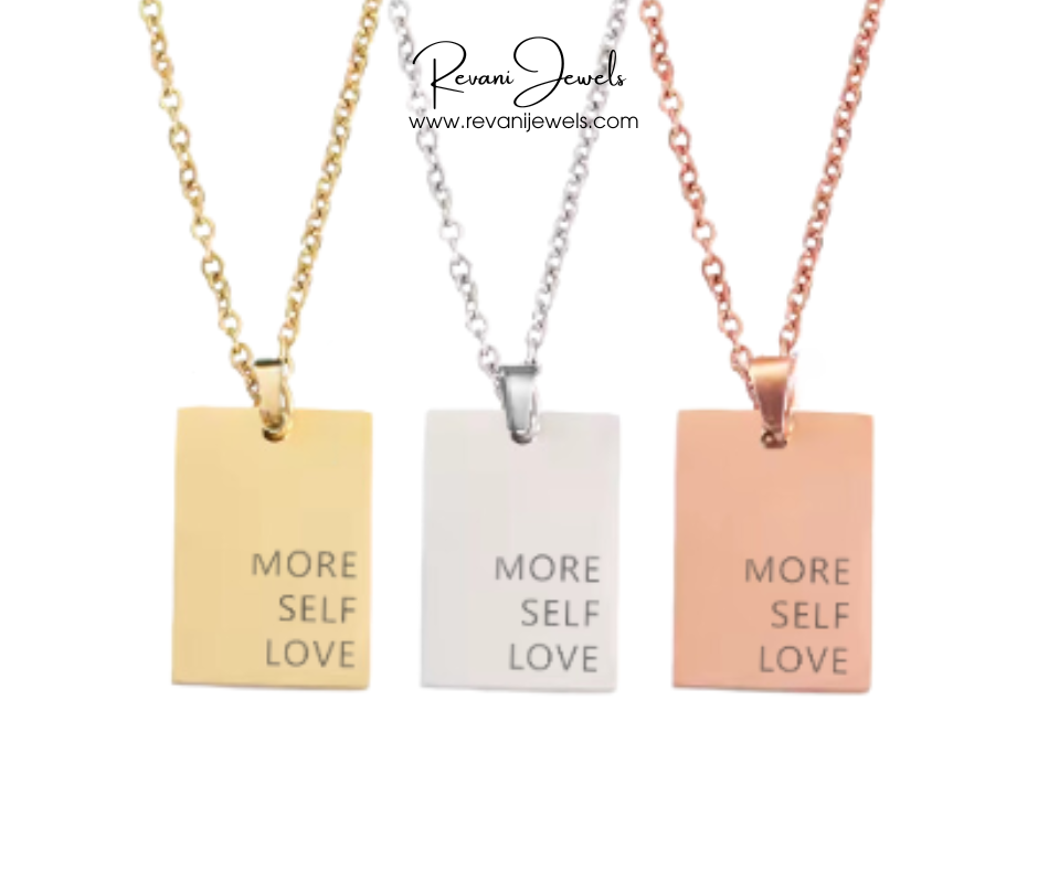 Three necklaces with 'More Self Love' pendants in gold, silver, and rose gold on a white background.