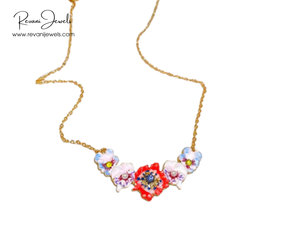 Colorful floral necklace with gold chain on a white background, branded 'Revani Jewels'.
