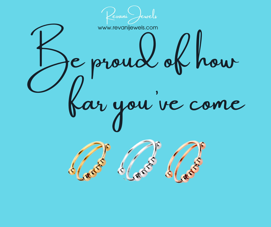 Three gold rings on a blue background with motivational text and Revan Jewels branding.