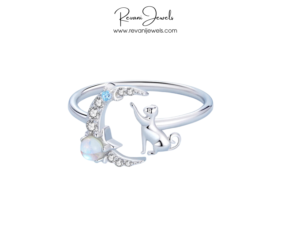 Silver ring with moon and dog design on a white background, branded as Revani Jewels.