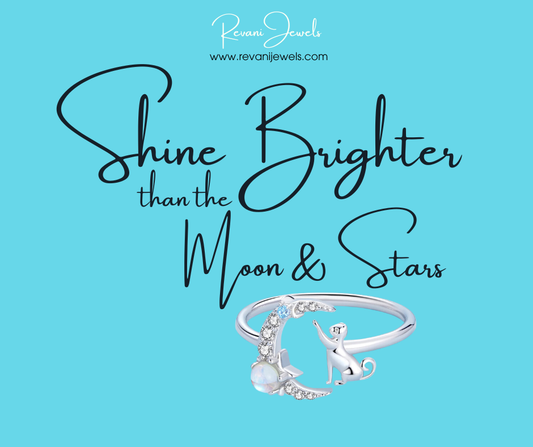 Silver ring with moon and star design on a blue background with text 'Shine Brighter than the Moon & Stars' and brand name 'Revan Jewels'.