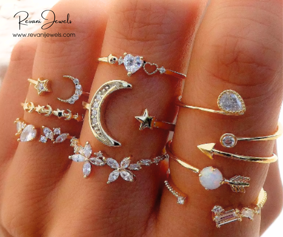 Collection of various gold and silver rings on a hand with Revani Jewels branding.