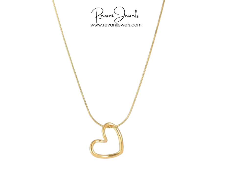 Gold heart-shaped pendant necklace on a white background with 'Revani Jewels' branding.