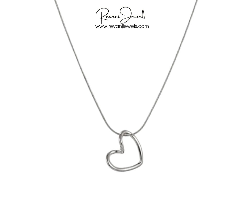 Heart-shaped pendant on a chain with Revani Jewels branding.