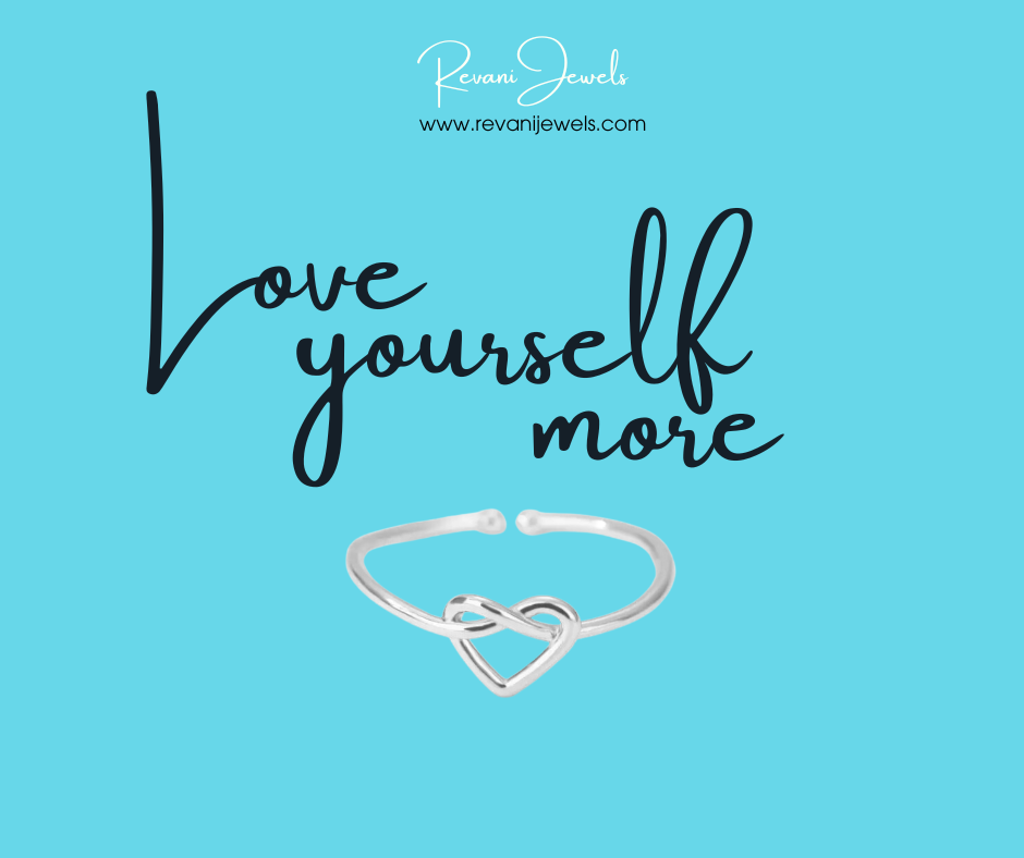 Silver ring with heart design on a blue background with 'Love yourself more' text and Revani Jewels branding.