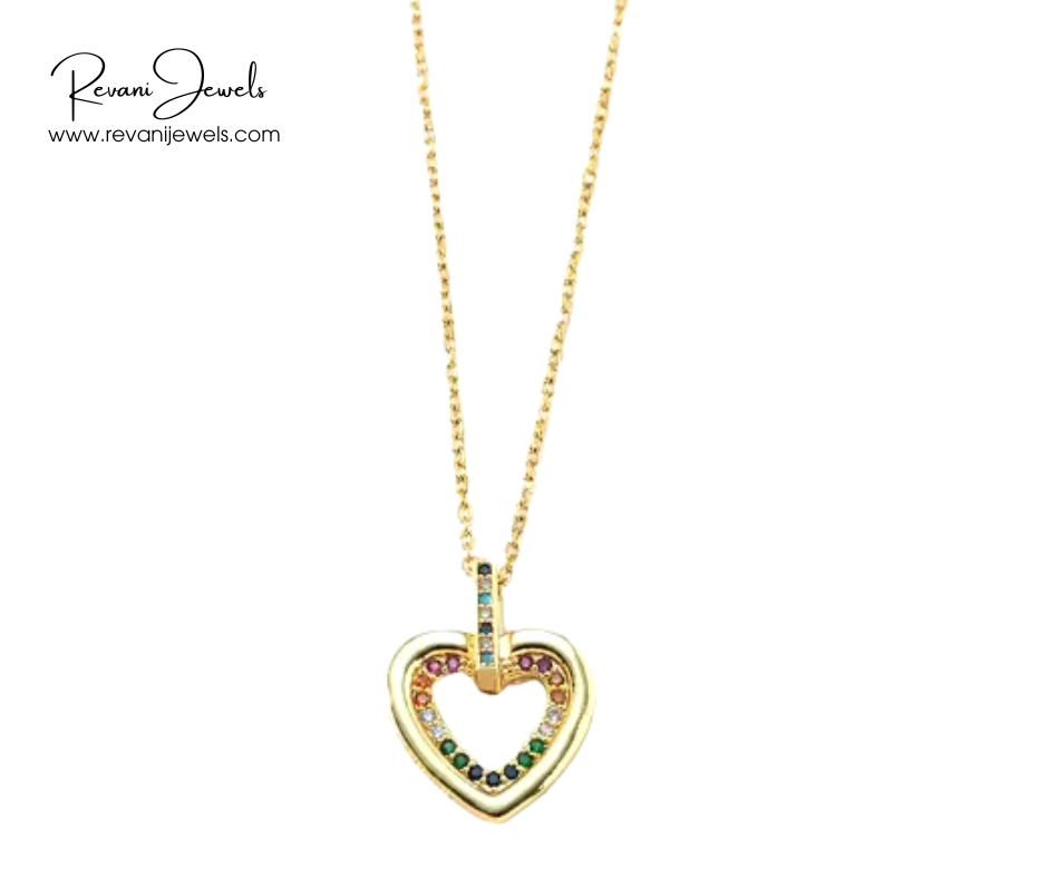 Gold heart-shaped necklace with colorful stones on a white background, branded 'Revani Jewels'.